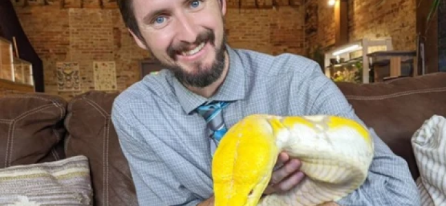 Clint from Clints reptiles holding a snake