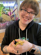 Kasey, Zen Habitats animal care manager holding a crested gecko